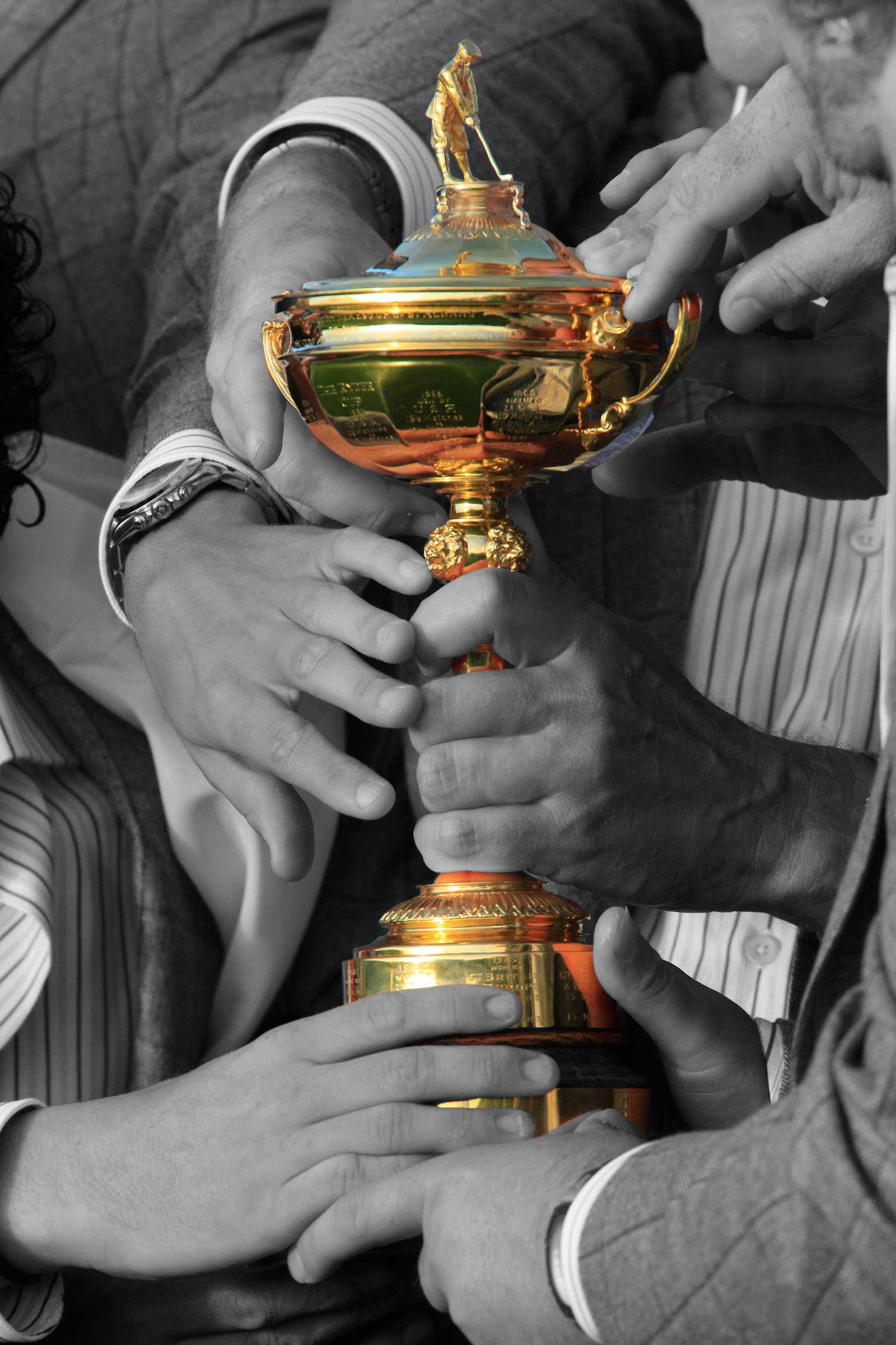 Some people holding a trophy