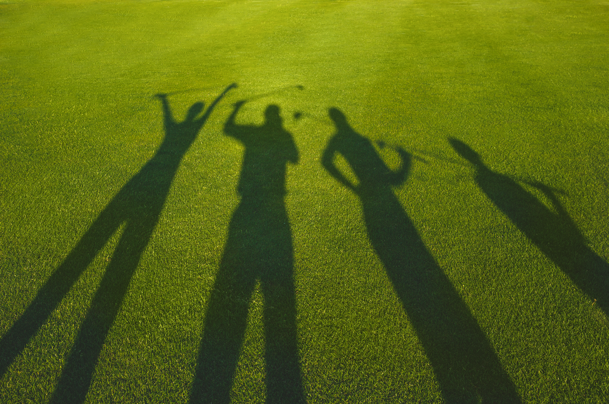 The shaddow of some golfers