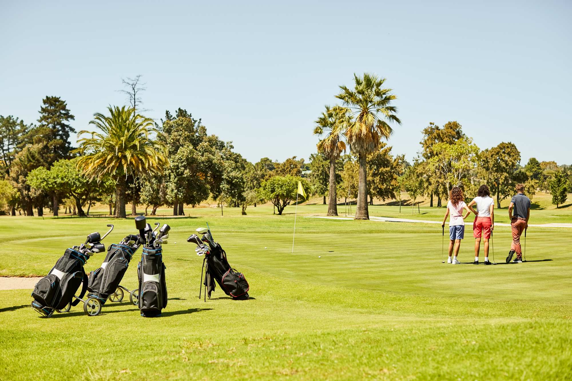 A group of people playing golf