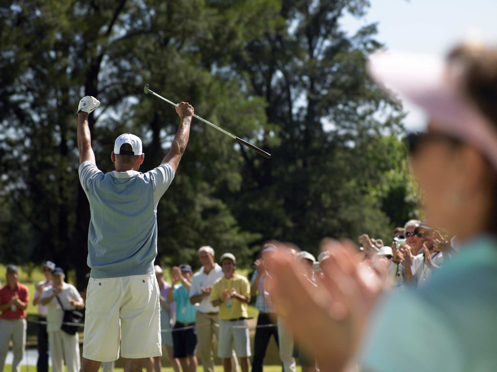 Audience cheering a golf player